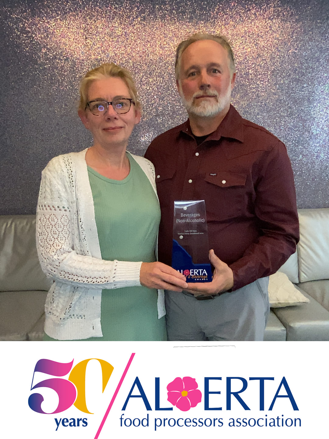 Eagle Hill Farm owners holding the 2024 AFPA Beverages (Non-Alcoholic) award